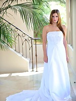 Danielle poses in a long white gown