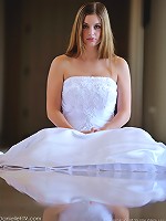 Danielle poses in a long white gown