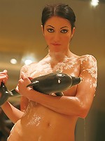 Suri plays in the bath tub