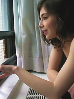 An intimate moment with a young girl as she gets naked in her apartment.