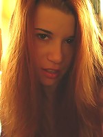 Beautiful sun drenched nude lying naked on a mattress.