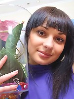 The blossoms on display can't begin to compete with the way she flowers in her dress and panties.