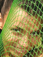 Sexy teen is naked under fishnet