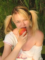 Sexy blonde plays with dildo outdoors