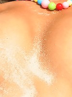 Gorgeous teen is naked in the sand