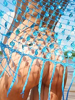 Sweet teen is naked on the beach