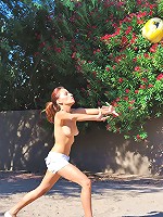 Valerie plays naked in a park