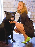 Kasey in heels uses a huge dildo on a petite pussy