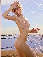 Glamorous model Kara in her skimpy blue nightie teasing at the shoot