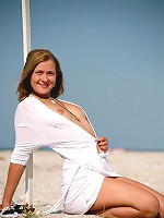 Gorgeous Margo posing on the football field