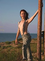 Beautiful brunette babe stripping outdoors