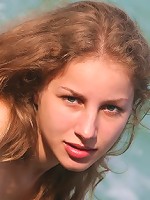 Blonde with shaved pussy and curly hair spreading legs outdoor