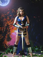 Busty brunette warrior babe taking off her blue dress