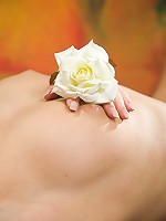 Petite teen with small breasts spreading her long legs