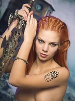 Sexy redhead goddess posing with the sword