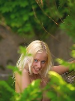 Charming golden haired naked Silvia in forest