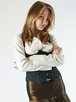 Young blonde teacher girl shows her breasts and spread her legs in the stockings