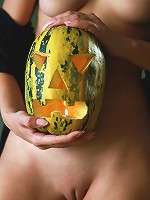 Trick or Treat! Beautiful brunette teen with the pumpkin-head