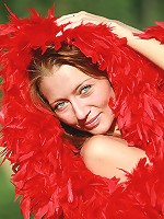 Skinny and petite redhead Kesy posing naked with the red boa
