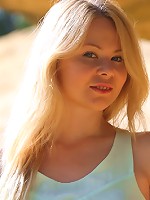 Sexy blonde plays with her nude, responsive body in the sand