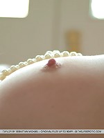 Taylor's lace panties slips down her to her ankles as she prepares to please herself by the window.