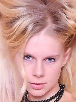 Clad in dainty black garter belt with matching thigh-high stockings that accentuate her elegant allure, one can't help but fantasize about Gabi's erotic body with fair and supple skin.