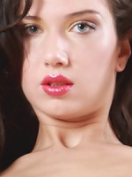 Wearing a powder blue night dress that accentuates her slender body and smooth, creamy skin, and strappy stiletto sandals that showcases her long, slender legs, Zhanna is an alluring goddess.