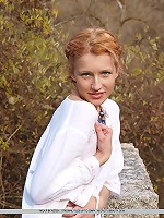 Immaculately dressed in a white dress, Mila portrays a young maiden, carefree and innocent with no hint of inhibitions.