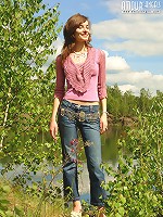 Girl pulling off her jeans